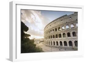 The lights of sunrise frame the ancient Colosseum (Flavian Amphitheatre), UNESCO World Heritage Sit-Roberto Moiola-Framed Photographic Print