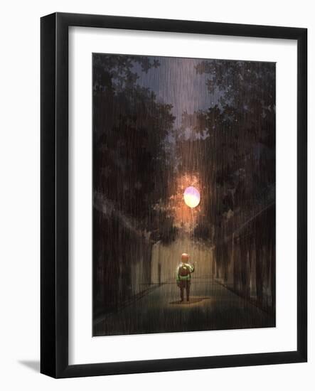 The Little Boy Holding a Bulb Balloon in the Dark Rain,Digital Painting Illustration-Tithi Luadthong-Framed Art Print