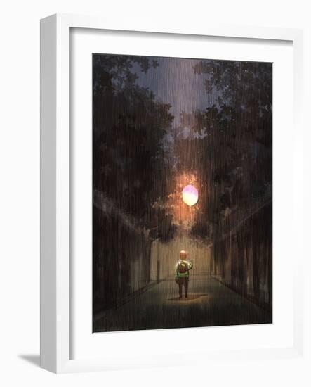 The Little Boy Holding a Bulb Balloon in the Dark Rain,Digital Painting Illustration-Tithi Luadthong-Framed Art Print
