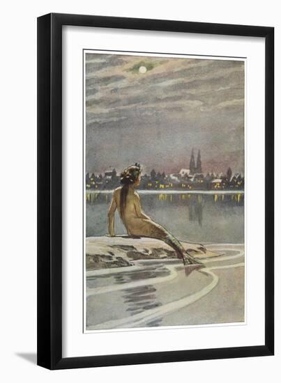 The Little Mermaid Sits on a Rock and Gazes at the Lights of the Distant Town-Paul Hey-Framed Photographic Print