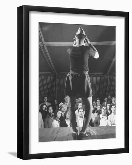 The Man from Mars Demonstrating How His Head Has Grown Since Entering the Army at Beginning of War-Cornell Capa-Framed Premium Photographic Print