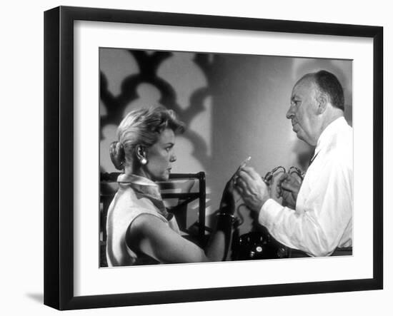 THE MAN WHO KNEW TOO MUCH, 1956 On the set, Alfred Hitchcock directs Doris Day (b/w photo)-null-Framed Photo