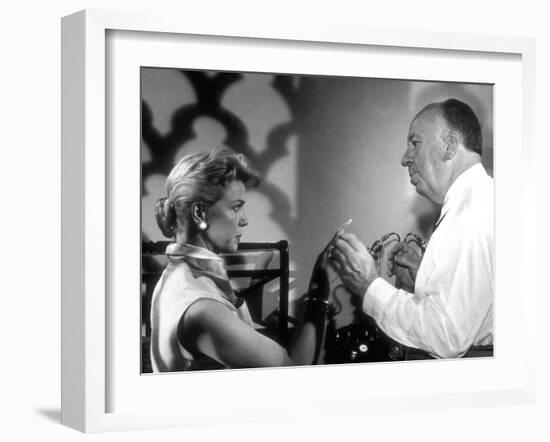 THE MAN WHO KNEW TOO MUCH, 1956 On the set, Alfred Hitchcock directs Doris Day (b/w photo)-null-Framed Photo