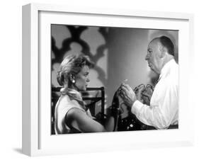 THE MAN WHO KNEW TOO MUCH, 1956 On the set, Alfred Hitchcock directs Doris Day (b/w photo)-null-Framed Photo