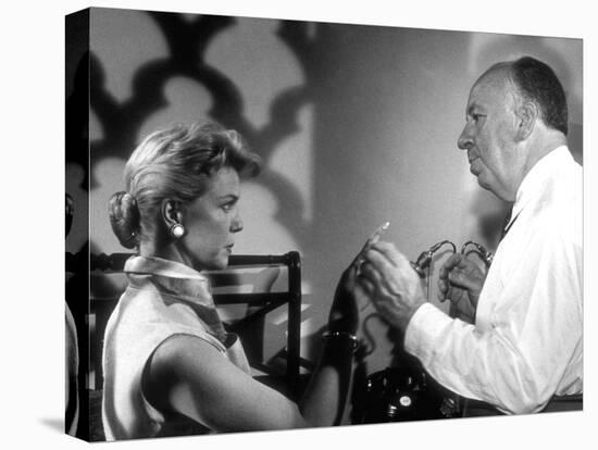 THE MAN WHO KNEW TOO MUCH, 1956 On the set, Alfred Hitchcock directs Doris Day (b/w photo)-null-Stretched Canvas