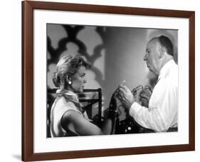 THE MAN WHO KNEW TOO MUCH, 1956 On the set, Alfred Hitchcock directs Doris Day (b/w photo)-null-Framed Photo