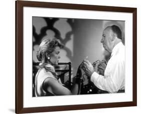 THE MAN WHO KNEW TOO MUCH, 1956 On the set, Alfred Hitchcock directs Doris Day (b/w photo)-null-Framed Photo