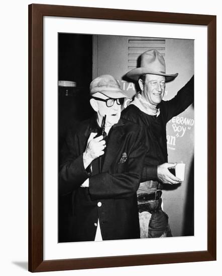 THE MAN WHO SHOT LIBERTY VALANCE, 1962 directed by JOHN FORD On the set, John Ford with John Wayne -null-Framed Photo