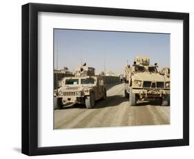 The Mine Resistant Ambush Protected All Terrain Vehicle and its Predecessor, the Humvee-null-Framed Photographic Print