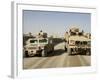 The Mine Resistant Ambush Protected All Terrain Vehicle and its Predecessor, the Humvee-null-Framed Photographic Print