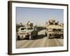 The Mine Resistant Ambush Protected All Terrain Vehicle and its Predecessor, the Humvee-null-Framed Photographic Print