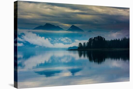 The misty mountains and calm waters of the Tongass National Forest, Southeast Alaska, USA-Mark A Johnson-Stretched Canvas