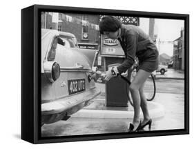 The Modern Female Petrol Pump Operator Refuelling a Car in Her Mini Skirt-null-Framed Stretched Canvas