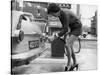 The Modern Female Petrol Pump Operator Refuelling a Car in Her Mini Skirt-null-Stretched Canvas