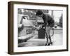 The Modern Female Petrol Pump Operator Refuelling a Car in Her Mini Skirt-null-Framed Premium Photographic Print