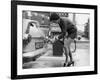 The Modern Female Petrol Pump Operator Refuelling a Car in Her Mini Skirt-null-Framed Photographic Print