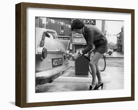 The Modern Female Petrol Pump Operator Refuelling a Car in Her Mini Skirt-null-Framed Photographic Print