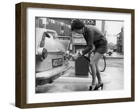 The Modern Female Petrol Pump Operator Refuelling a Car in Her Mini Skirt-null-Framed Photographic Print