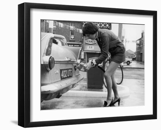 The Modern Female Petrol Pump Operator Refuelling a Car in Her Mini Skirt-null-Framed Photographic Print