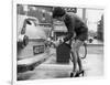 The Modern Female Petrol Pump Operator Refuelling a Car in Her Mini Skirt-null-Framed Photographic Print