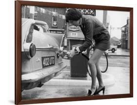 The Modern Female Petrol Pump Operator Refuelling a Car in Her Mini Skirt-null-Framed Photographic Print