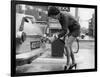 The Modern Female Petrol Pump Operator Refuelling a Car in Her Mini Skirt-null-Framed Photographic Print