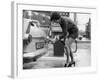 The Modern Female Petrol Pump Operator Refuelling a Car in Her Mini Skirt-null-Framed Photographic Print