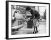 The Modern Female Petrol Pump Operator Refuelling a Car in Her Mini Skirt-null-Framed Photographic Print