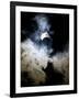 The Moon Partially Covers the Sun Behind the Clouds During a Partial Solar Eclipse-null-Framed Photographic Print
