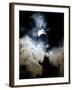 The Moon Partially Covers the Sun Behind the Clouds During a Partial Solar Eclipse-null-Framed Photographic Print