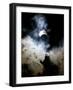 The Moon Partially Covers the Sun Behind the Clouds During a Partial Solar Eclipse-null-Framed Photographic Print