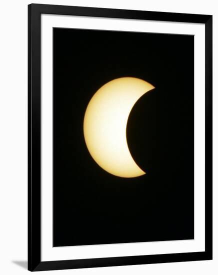 The Moon Partially Covers the Sun During the Peak of an Annular Eclipse Seen from Tel Aviv-null-Framed Photographic Print