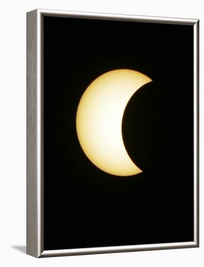 The Moon Partially Covers the Sun During the Peak of an Annular Eclipse Seen from Tel Aviv-null-Framed Photographic Print