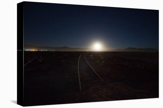 The Moon Rises over a Dead Train Line in Uyuni-Alex Saberi-Stretched Canvas