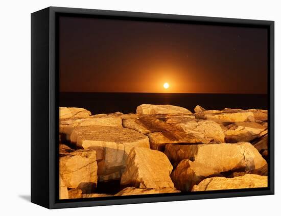 The Moon Rising Behind Rocks Lit by a Nearby Fire in Miramar, Argentina-Stocktrek Images-Framed Stretched Canvas