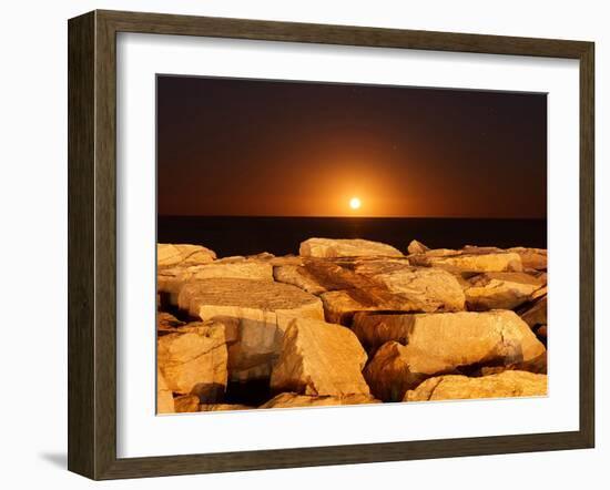The Moon Rising Behind Rocks Lit by a Nearby Fire in Miramar, Argentina-Stocktrek Images-Framed Photographic Print