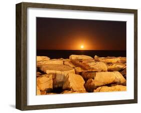 The Moon Rising Behind Rocks Lit by a Nearby Fire in Miramar, Argentina-Stocktrek Images-Framed Photographic Print