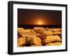 The Moon Rising Behind Rocks Lit by a Nearby Fire in Miramar, Argentina-Stocktrek Images-Framed Photographic Print