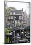 The Netherlands, Holland, Amsterdam, bicycle in canal-olbor-Mounted Photographic Print