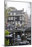 The Netherlands, Holland, Amsterdam, bicycle in canal-olbor-Mounted Photographic Print
