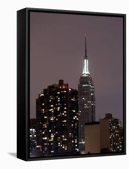The New York City Skyline is Darker as Many Buildings are Conserving Power-null-Framed Stretched Canvas
