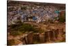 The Palace Walls of Mehrangarh Fort Towering over the Blue Rooftops in Jodhpur, the Blue City-Laura Grier-Stretched Canvas