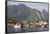 The picturesque fishing village of Reine surrounded by mountains on Moskenesoya-Ellen Rooney-Framed Stretched Canvas