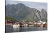 The picturesque fishing village of Reine surrounded by mountains on Moskenesoya-Ellen Rooney-Stretched Canvas