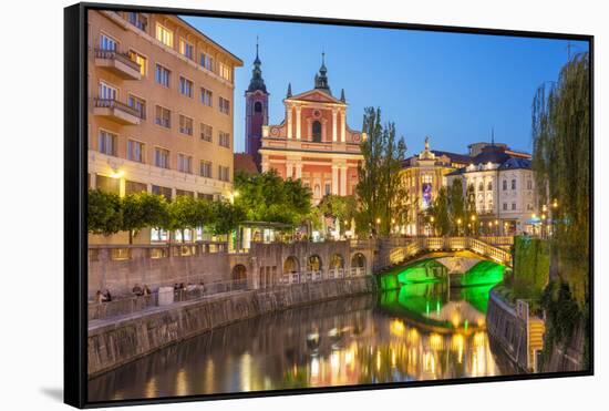 The pink Franciscan Church of the Annunciation, Ljubljanica River and the Triple Bridge, Slovenia-Neale Clark-Framed Stretched Canvas