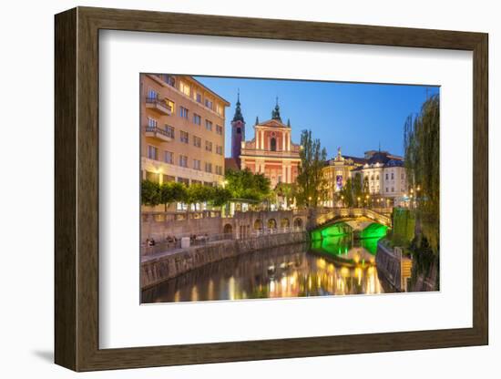 The pink Franciscan Church of the Annunciation, Ljubljanica River and the Triple Bridge, Slovenia-Neale Clark-Framed Photographic Print