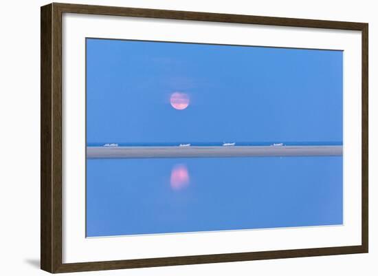 The pink full moon is reflected in the blue water of the Notteri pond, Villasimius, Sardinia, Italy-Roberto Moiola-Framed Photographic Print