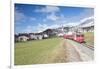 The red train runs across the alpine village of Zuoz in spring, Maloja, Canton of Graubunden, Engad-Roberto Moiola-Framed Photographic Print