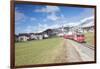 The red train runs across the alpine village of Zuoz in spring, Maloja, Canton of Graubunden, Engad-Roberto Moiola-Framed Photographic Print