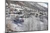 The red train runs across the snowy landscape around Samedan, Maloja, Canton of Graubunden, Engadin-Roberto Moiola-Mounted Photographic Print